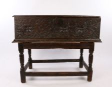 An impressive Elizbeth I/ James I large oak boarded box, circa 1600/1620, the plank top above a