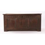 Charles II oak coffer, the hinged rectangular top enclosing a candle box and storage space, the