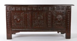 A rare Charles II oak coffer, West Country, dated 1661, having a quadruple-panelled lid, the front