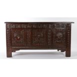 A rare Charles II oak coffer, West Country, dated 1661, having a quadruple-panelled lid, the front