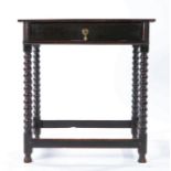 A small Charles II oak side table, circa 1670, having a one-piece top, the frieze drawer with half-