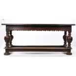 German early 17th Century oak refectory table, the removable pegged rectangular top above a frieze