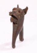 Charming 19th Century nutcracker, carved in softwood as a moustached dog and inset orange glass