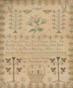 19th Century needlework sampler, with central verse surrounded by foliage and a basket, inscribed