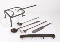 Metalwork, to include an 18th Century trivet, two ladles, a fork, a set of hooks and a spatula, (6)