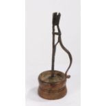 An early 19th Century English candleholder, circa 1820, North England, the wrought iron arm with