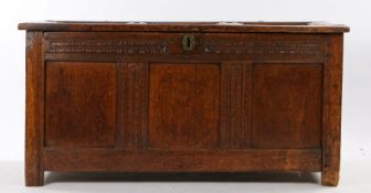 Charles I oak coffer, circa 1630, West Country, with a three panel hinged top above a carved