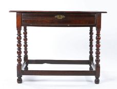 Charles II oak side table, circa 1670, having a top of two ovolo-moulded boards, a single frieze