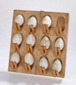 Early 20th Century set of Hen "pot" eggs, the pottery eggs some named Ovum in pale blue placed