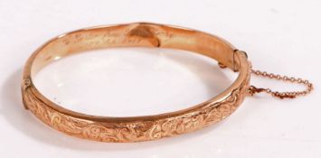 9 carat gold bangle with foliate decoration, diameter 6.5cm gross weight 8.9 grams