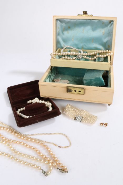 Collection of simulated pearls housed in a jewellery box to include a pair of 9ct gold and Pearl