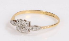 18 carat gold and diamond ring, with a single diamond surrounded by platinum in the from of a flower