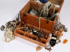 Large collection of costume jewellery to include brooches necklaces and a variety of others housed