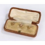 Three 10 carat gold collar studs, gross weight 1.7 grams