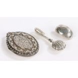 Silver locket with foliate decoration, silver napkin holder in the form of a shell and a singular