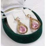 Pair of 9 carat gold puce and clear paste earrings, of teardrop form, 4.2g