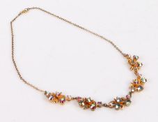 Yellow metal necklace of floral decoration with coloured paste stones