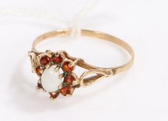 9 carat gold garnet and opal ring, with a central opal surrounded by eight garnets, ring size R