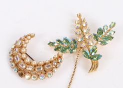 Two yellow metal brooches, one of crescent form set with paste and pearls the other of floral