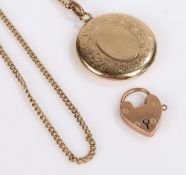 9 carat gold locket and chain the locket is decorated with a floral design together with a 9 carat