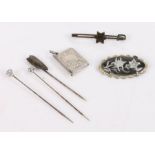 Three white metal stick pins together with a novelty silver satchel charm an a brooch (6)