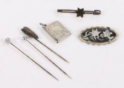 Three white metal stick pins together with a novelty silver satchel charm an a brooch (6)