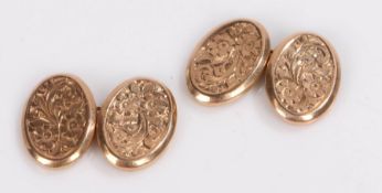 Pair of 9 carat gold cufflinks, with foliate decorated oval links, 3.3g