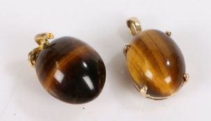 9 carat gold set tigers eye pendant, 14mm diameter, together with a tigers eye pendant with a yellow