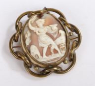 Cameo brooch depicting a neoclassical scene of a lady and a bird, with a brass inter woven border