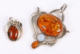 Silver and amber pendant together with a silver and amber brooch, gross weight 47.5 grams