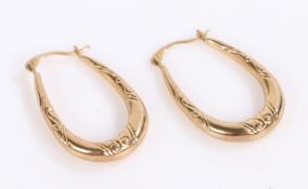 Pair of Yellow metal earrings with classical design to the sides (2)