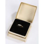 18 carat gold, platinum and diamond ring, set with three diamonds, ring size M, 2.2g