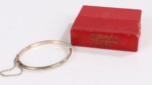 Silver bangle with an engraved design to the front, diameter 6cm gross weight 4.8 grams