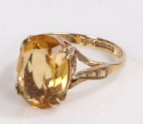 9 carat gold ring set with a navette cut yellow glass stone, ring size N and a half gross weight 3.6