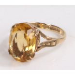 9 carat gold ring set with a navette cut yellow glass stone, ring size N and a half gross weight 3.6