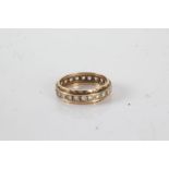 9 carat gold eternity ring set with clear paste, ring size P, 3g