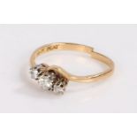 18 carat gold and diamond ring, the head set with three diamonds in a crossover style, band cut, 2.