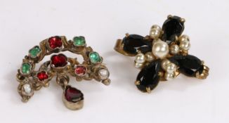 Two brooches one set with green and red stones on yellow metal the other is set with simulated