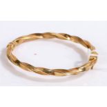 9 carat gold bangle with a twist effect, gross weight 7.4 grams