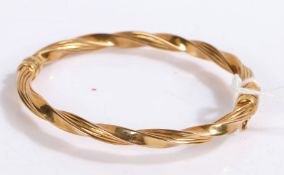 9 carat gold bangle with a twist effect, gross weight 7.4 grams