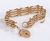 9 carat gold bracelet with a heart locket, gross weight 8.4 grams