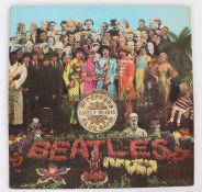 The Beatles Sgt. Peppers Lonely Hearts Club Band LP (PMC 7027), with insert.VG.