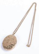 9 carat gold locket, of oval form with scroll decorated exterior, on a 9 carat gold necklace, 18.3