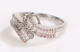 9 carat white gold and diamond ring, set with two sweeps of baguette cut diamonds flanked by pink