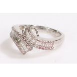 9 carat white gold and diamond ring, set with two sweeps of baguette cut diamonds flanked by pink