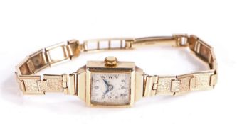 9 carat gold ladies wristwatch, having square silvered dial with Arabic numerals, 15mm wide, on a