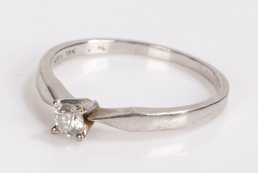 18 carat white gold diamond set solitaire ring, the round cut diamond at an estimated 0.20 carat,