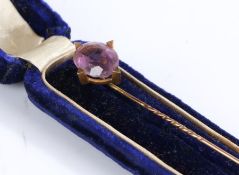 Yellow metal and amethyst stick pin