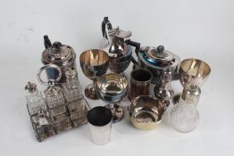 Silver plated ware, to include teapot, hot water pot, ewer, cruet frame goblets, sugar castor, sugar