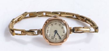 9 carat gold ladies wristwatch, the engine turned effect dial with Arabic numerals, manual wound,